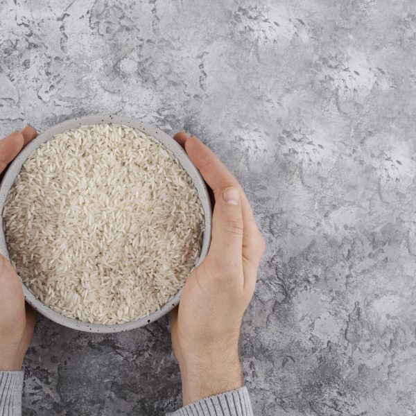 top-view-hands-holding-bowl-with-rice-min-min